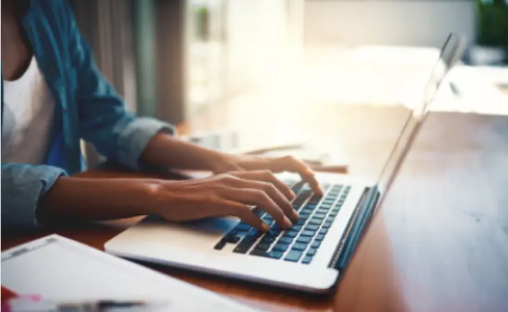 A person typing on a computer. 