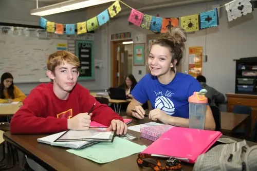Students working at a desk