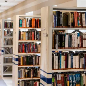 A row of bookshelves in a library