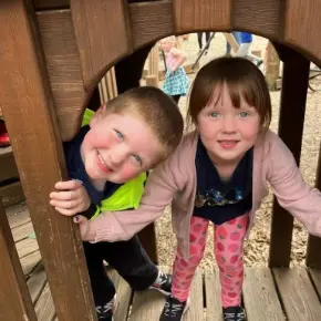Two students playing on the playground