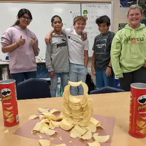 students with a Pringles tower they built