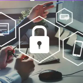 An image of a lock in the center with a computer behind it