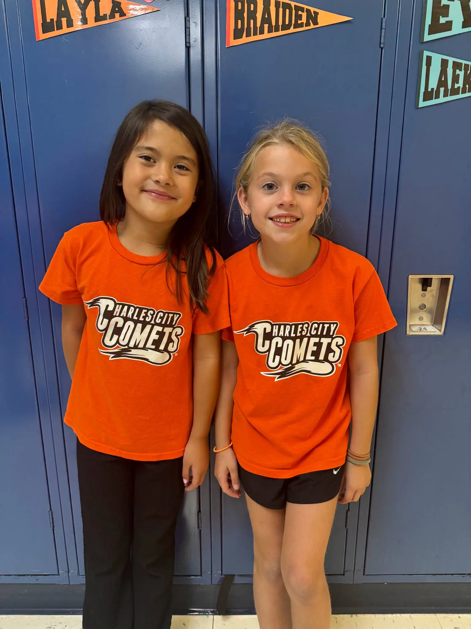 Elementary students wearing Charles City Comets shirts