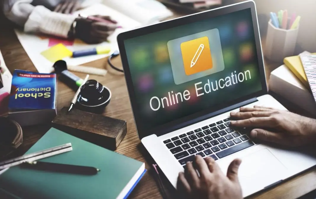 laptop computer showing online education on the screen