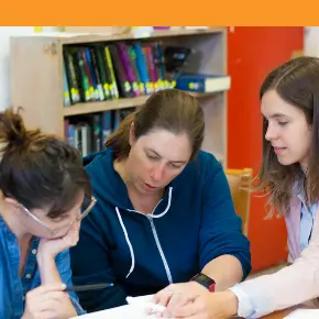 Image of teacher with students