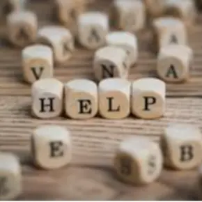 Wooden Blocks Spelling Out "Help"