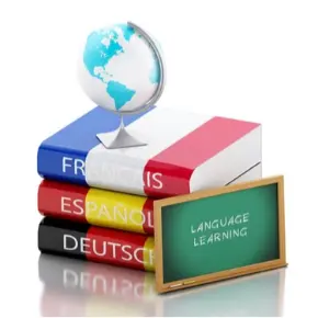 foreign language books stacked with a globe and small chalkboard