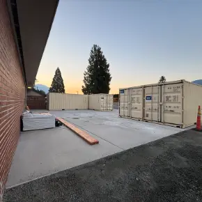 Picture of new concrete slab and containers