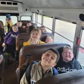 Children riding on a school bus
