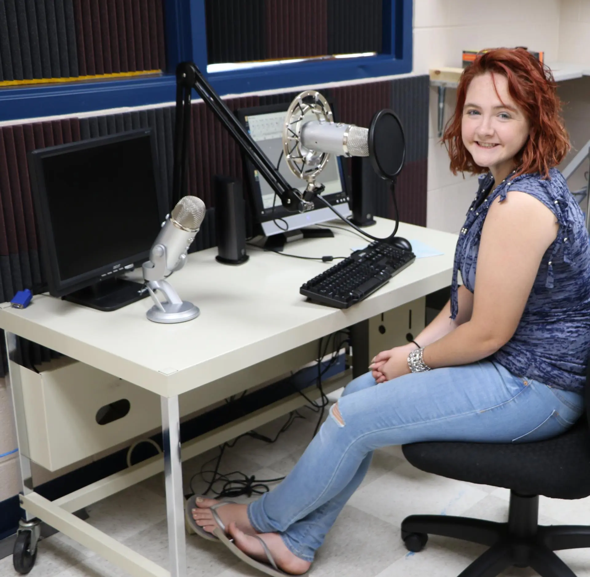 student in front of editing desk