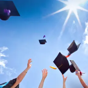 Grads throwing their motorboards