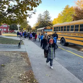 Students getting off school busses