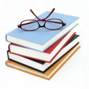 Stack of books with glasses on top