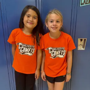 Two young students wearing Charles City Comets shirts