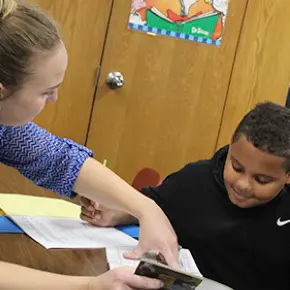 teacher and student working on homework