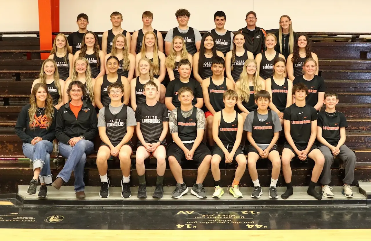 Group photo on gym bleachers