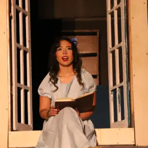 Female student performing in a musical