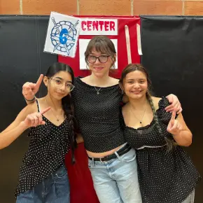 Three female students at a Speech Competition