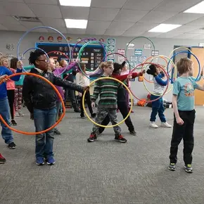 Music class working with hula hoops