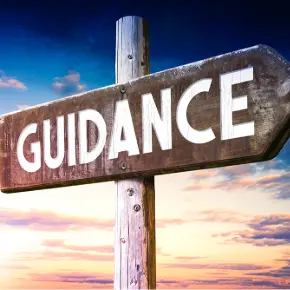 A sign that reads Guidance